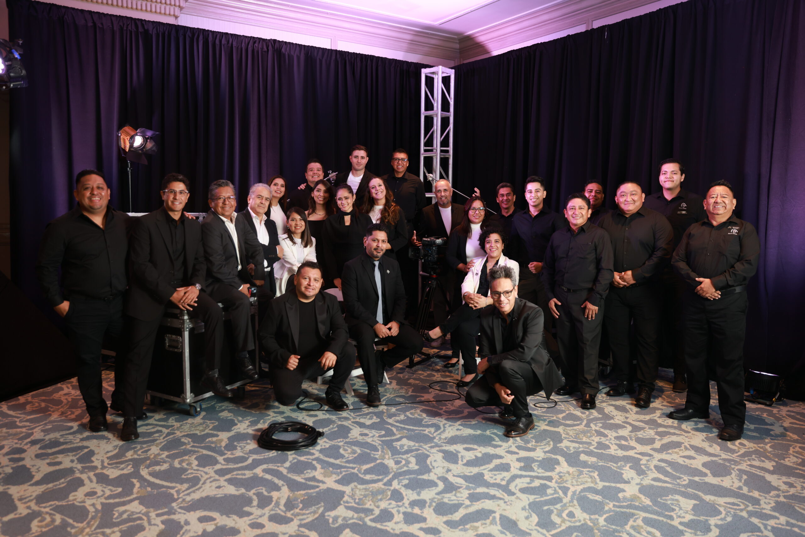 Event production team at Mills James, preparing for a live event with professional lighting and staging.