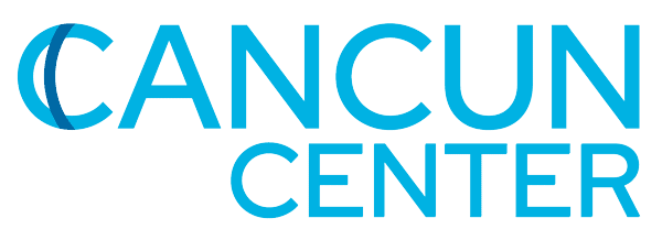 Modern event space at Cancún Center with vibrant lighting and spacious interior.